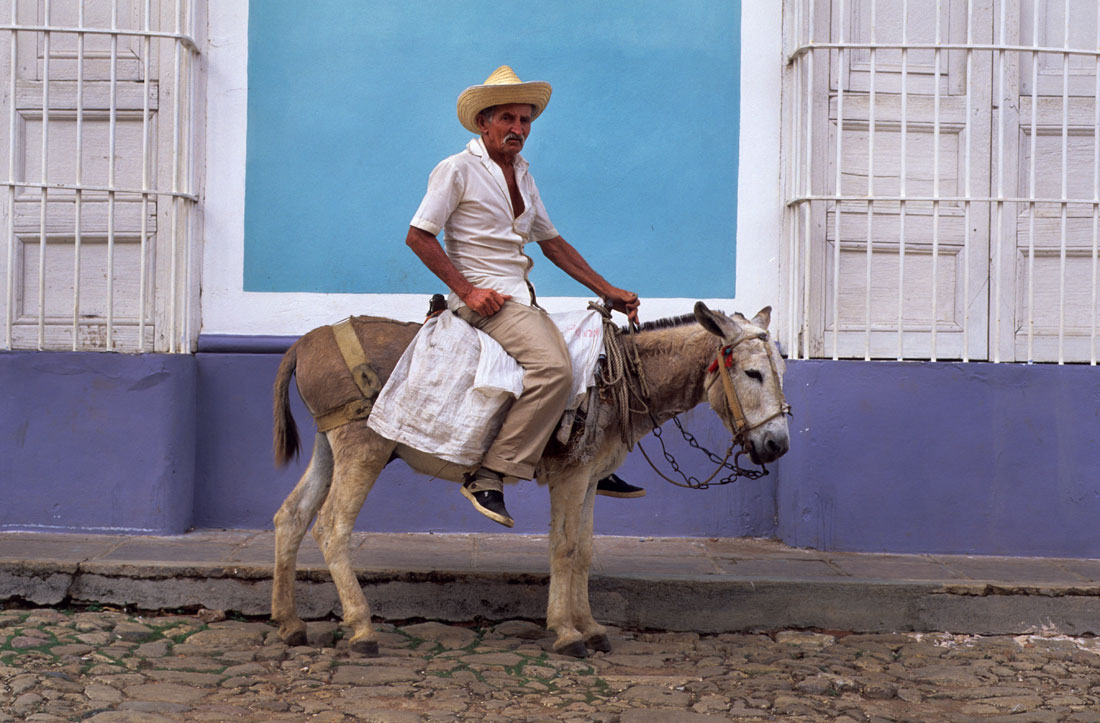 Trinidad Man riding a donkey